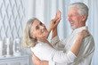 © aletia2011 - Portrait of cheerful senior couple dancing at home