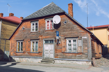 City Cesis, Latvia. Street with old wooden house and buildings.