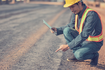 Foreman building construction hold tablet inspection work on site