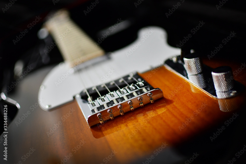 Fender Telecaster electric guitar in two tone sunburst color close-up - obrazy, fototapety, plakaty 