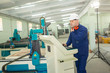 © Bogdan - Worker in the Hard Hat Modern Factory CNC machine operator . Successful, Handsome Man in Modern Industrial Environment.Emotions, Copy Space