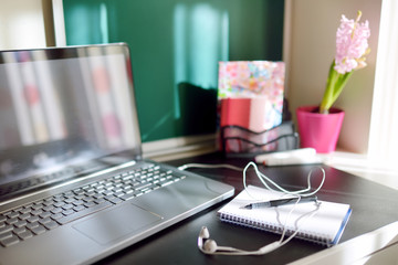 Laptop computer at productive home workplace. Using tablet computers and gadgets to work or study from home. Online education and distance learning. Homeschooling during quarantine. S