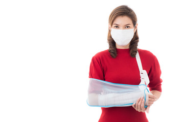 Woman with bandage in arm and mask