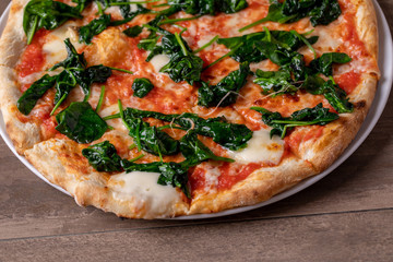 details of fresh tasty spinach pizza