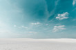 © LIGHTFIELD STUDIOS - beautiful beach with white sand and blue sky with white clouds