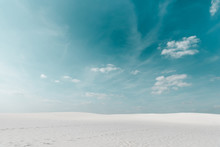 Beautiful Beach With White Sand And Blue Sky With White Clouds