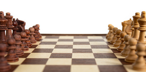 Chess pieces lined up on the chessboard. Concept picture concerning decision making and strategy.