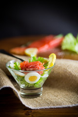 Wall Mural - lettuce salad with salted salmon, boiled eggs