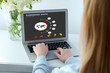 © New Africa - Woman with laptop checking pandemic data indoors, closeup. Coronavirus outbreak