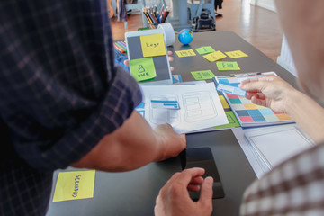 Wall Mural - soft focus and blur,a group of web designers are working together to develop a mobile responsive web