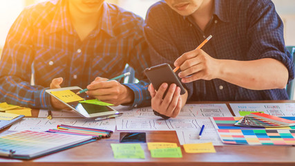 Sticker - soft focus and blur,a group of web designers are working together to develop a mobile responsive web