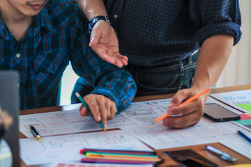 Soft Focus and Blur,A group of web designers are working together to develop a mobile responsive website with UI UX Front End Designer Previewing. Website development concept UI UX front end designer 