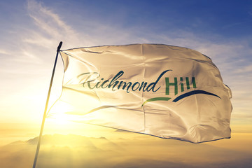 Wall Mural - Richmond Hill of Ontario of Canada flag waving on the top sunrise mist fog