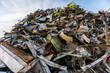 Huge mountain of metal pieces of different origin accumulated in a scrap yard