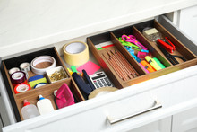 Different Stationery In Open Desk Drawer Indoors