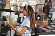 © Trevor Adeline/Caia Image - Woman shopping in home decor shop