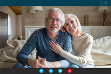 Portrait Screen Application View Of Happy Mature Grandparents Sit Relax At Home Have Video Call With Relatives, Smiling Elderly Man And Woman Talk Speak Online Using Webcam Conference On Computer