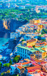 Cityscape of Marina Grande with houses and port Sorrento reflex