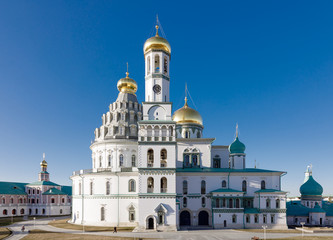 Temple of white stone with golden domes, the Cathedral of the New Jerusalem Monastery, Russia, Istra.