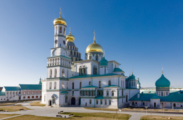 Temple of white stone with golden domes, the Cathedral of the New Jerusalem Monastery, Russia, Istra.