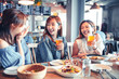 © Tom Wang - happy young woman sitting in  restaurant and enjoy dinner and beer