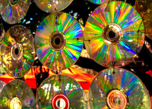 Hanging Old CDs Outside Create Vivid Rainbows In The Garden.