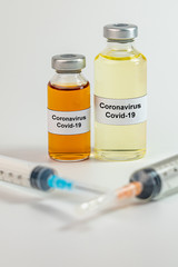 Wall Mural - Vertical photo of Coronavirus vaccine concept on the white background