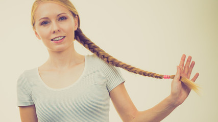 Blonde girl with long braid hair