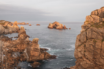 Wall Mural - Incredible cliffs on the coast near the village of Liencres before sunrise. Cantabria. Northern coast of Spain