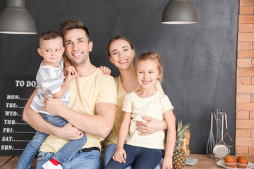 Wall Mural - Young family in kitchen at home