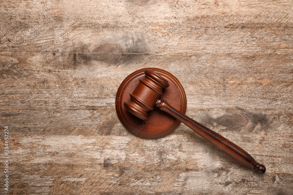 Judge's gavel on wooden background