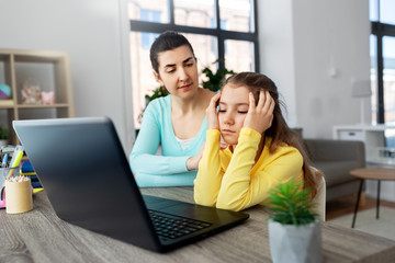 Sticker - education, family and distant learning concept - mother and bored daughter with laptop computer doing homework together at home