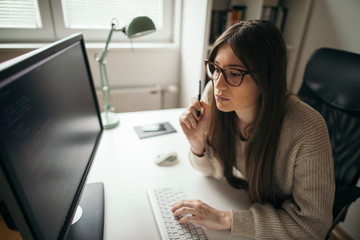 Wall Mural - Young businesswoman working from her home office