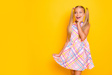 Poster - Photo of beautiful cheerful little lady arm on cheekbone look side empty space see black friday advertisement wear checkered summer dress isolated yellow bright color background