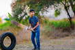 © PRASANNAPIX - Rural Indian Child Playing Cricket