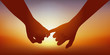 Concept du sentiment amoureux avec un couple qui se donne la main en signe d’union.