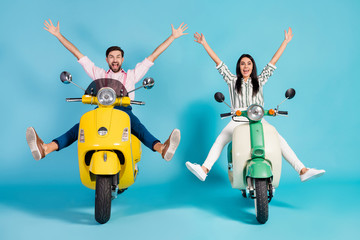 Sticker - Full length photo of funky two people lady guy drive retro moped good mood weather spread legs near puddle raise arms crazy formalwear clothes isolated blue color background