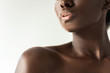 © LIGHTFIELD STUDIOS - cropped view of tender nude african american girl isolated on grey