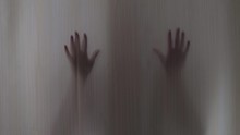Shadow Of A Scary Woman Hands Scratching The The Curtain. Blurry Scary Or Horror Hands