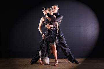 Wall Mural - dancers in ballroom isolated on black background