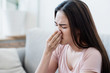© Seksan - Sick fever asian woman use tissue blow a nose with tired face. Healthy, medicine taking, Respiratory disease, sickness, cold, health care, allergy, pharmacy, coronavirus, covid-19 prevent concept.