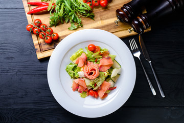 Wall Mural - fresh salad of vegetables and salmon