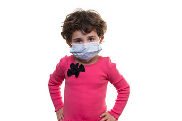 Young girl wearing a protective medical facial mask isolated on a white background.