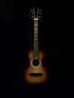 © Сергій Колесніков - Six-stringed acoustic guitar on a black background. Musical string instrument. Guitar fretboard.