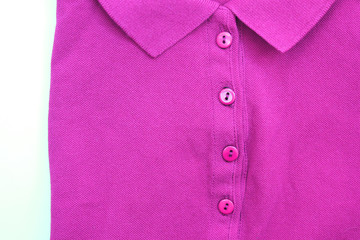 Wall Mural - Purple polo shirt casual clothing close up top view. Buttoned colorful collar neck t-shirt, light violet fashion clothes detail