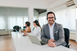 © bnenin - Portrait of a handsome businessman telemarketer at work.