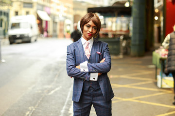 Wall Mural - a portrait of a young woman dressed in a tweed suit