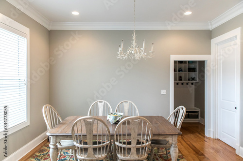 Fotomural Informal kitchen dining room with a large window, natural light and hardwood flo