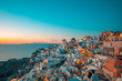 Great evening view of Oia, Santorini island. Wonderful summer sunset on the famous travel destination background. Tranquil vacation tourism