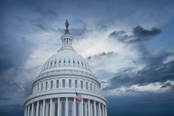 US Capitol dome under stormy skies